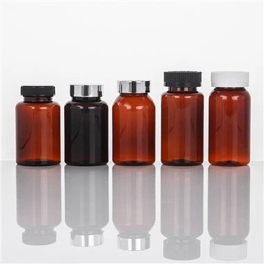 Gintaro spalvos plastikinis butelis vitaminams